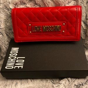 Moschino red quilted crossbody/clutch bag.